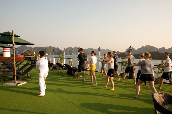 Luxury cruise navigating through the stunning limestone karsts of Ha Long Bay, Vietnam, photo 6 | wizardtrip