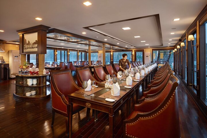 Luxury cruise navigating through the stunning limestone karsts of Ha Long Bay, Vietnam, photo 9 | wizardtrip