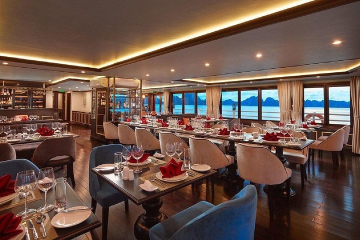 Luxury cruise navigating through the stunning limestone karsts of Ha Long Bay, Vietnam, photo 26 | wizardtrip