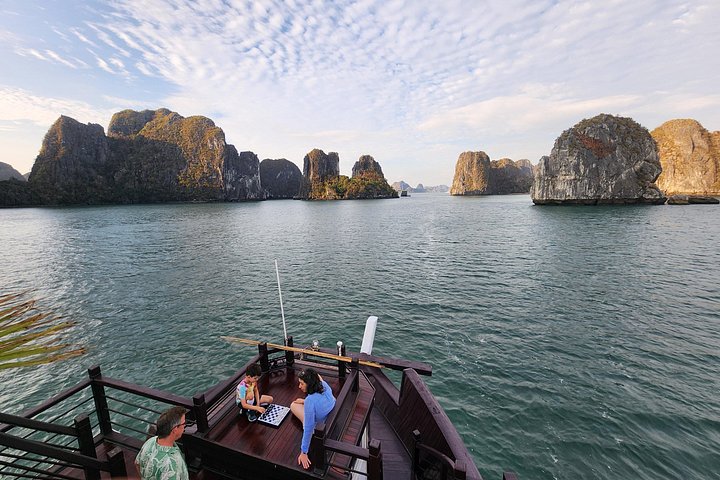Luxury cruise navigating through the stunning limestone karsts of Ha Long Bay, Vietnam, photo 27 | wizardtrip