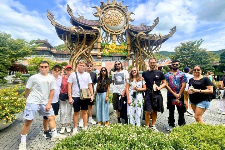 Tourists exploring the iconic Golden Bridge at Ba Na Hills, Vietnam, with its unique hand-shaped supports, photo 12 | wizardtrip