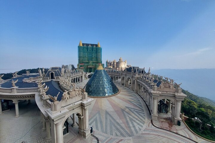 Tourists exploring the iconic Golden Bridge at Ba Na Hills, Vietnam, with its unique hand-shaped supports, photo 22 | wizardtrip