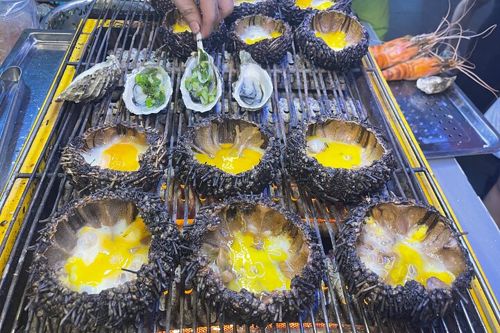 Tour de comida callejera en moto en Ciudad Ho Chi Minh, Vietnam, con platos locales y conductores, foto 18 | wizardtrip