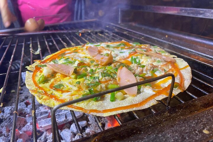 Tour de comida callejera en moto en Ciudad Ho Chi Minh, Vietnam, con platos locales y conductores, foto 24 | wizardtrip