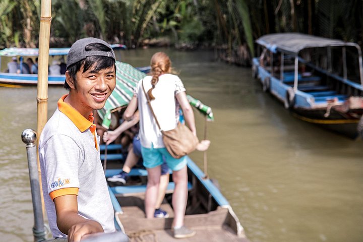 A scenic boat tour through the lush Mekong Delta canals, showcasing local life and tropical landscapes, photo 13 | wizardtrip