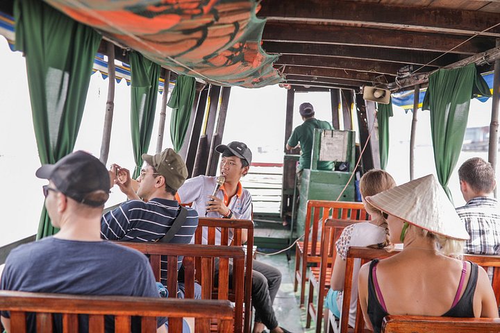 A scenic boat tour through the lush Mekong Delta canals, showcasing local life and tropical landscapes, photo 14 | wizardtrip