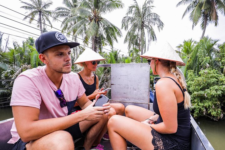 A scenic boat tour through the lush Mekong Delta canals, showcasing local life and tropical landscapes, photo 15 | wizardtrip