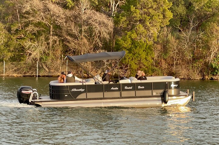 Scenic 1-hour sunset boat cruise on Lake Austin, passing landmarks like Mount Bonnell and Pennybacker Bridge, photo 11 | wizardtrip