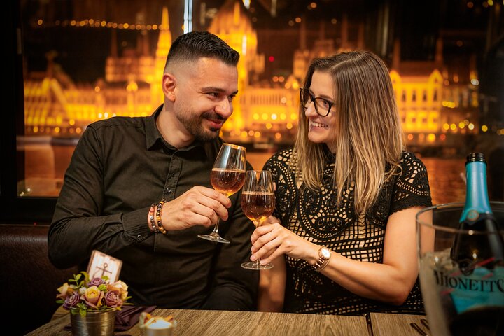 Enjoy a romantic dinner cruise on the Danube River in Budapest, featuring illuminated landmarks and live music, photo 8 | wizardtrip