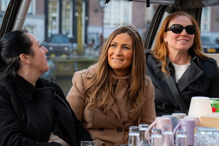 Enjoy a scenic small-group canal cruise in Amsterdam, complete with snacks and drinks, photo 12 | wizardtrip