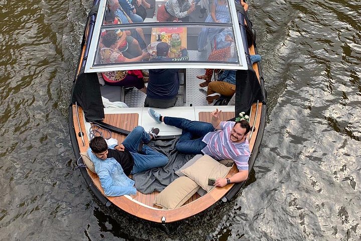 Enjoy a scenic small-group canal cruise in Amsterdam, complete with snacks and drinks, photo 19 | wizardtrip