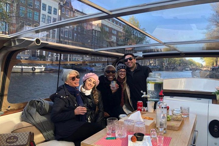 Enjoy a scenic small-group canal cruise in Amsterdam, complete with snacks and drinks, photo 23 | wizardtrip