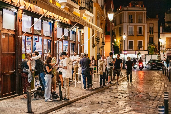 Enjoy authentic tapas and local drinks on a guided food tour through Seville's charming neighborhoods, photo 6 | wizardtrip
