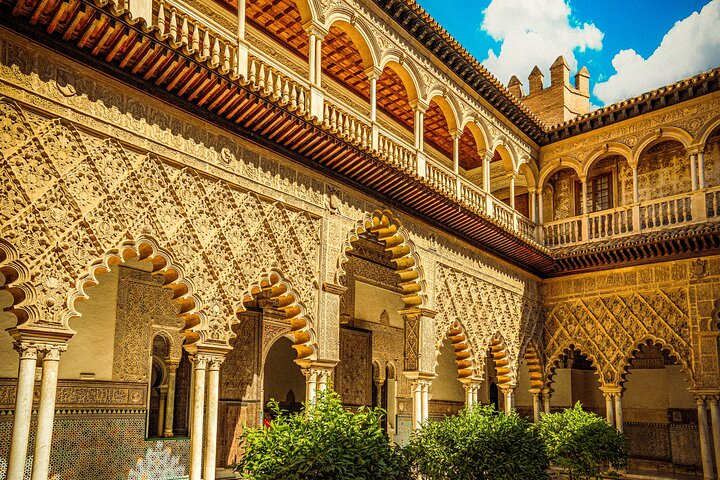 Guided tour of Seville's Alcázar, Cathedral, and Giralda Tower, showcasing historical architecture and city views, photo 9 | wizardtrip