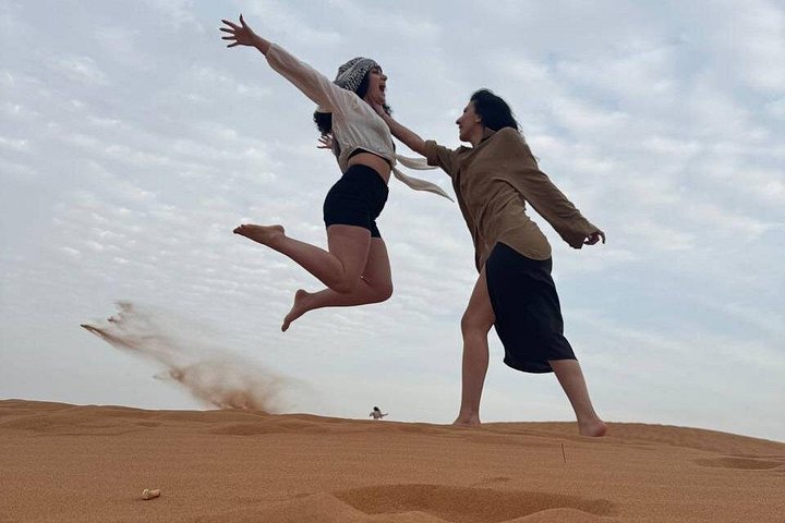 Experience a thrilling desert safari in Dubai with dune bashing, quad biking, camel rides, and a BBQ dinner under the stars, photo 11 | wizardtrip