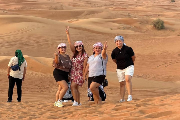 Experience a thrilling desert safari in Dubai with dune bashing, quad biking, camel rides, and a BBQ dinner under the stars, photo 21 | wizardtrip
