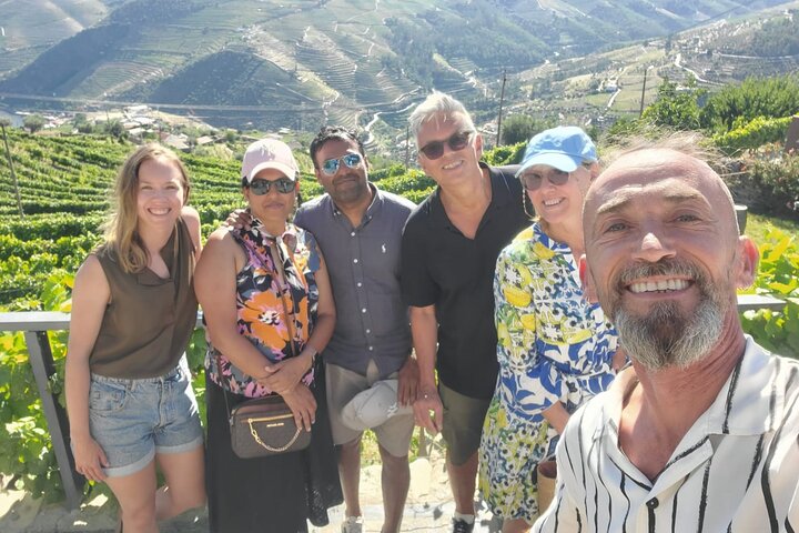Scenic Douro Valley tour from Porto featuring vineyards, wine tasting, and river cruise, photo 6 | wizardtrip