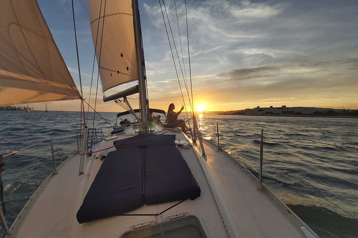 Enjoy a sunset sailing tour in Lisbon with wine and historical sights, photo 7 | wizardtrip
