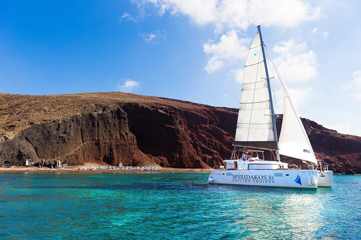 Catamaran sailing cruise in Santorini with BBQ, open bar, and stunning caldera views, photo 1 | wizardtrip