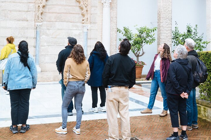 Guided tour of the Alcazar of Seville, showcasing its stunning architecture and gardens, photo 6 | wizardtrip