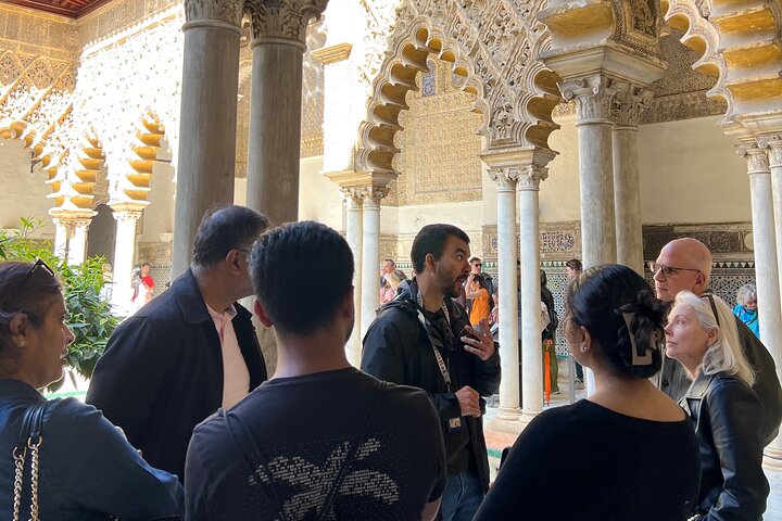 Guided tour of the Alcazar of Seville, showcasing its stunning architecture and gardens, photo 9 | wizardtrip