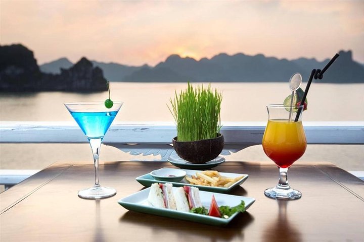Overnight cruise adventure in Halong Bay, Vietnam, featuring limestone karsts, kayaking, and onboard dining, photo 14 | wizardtrip