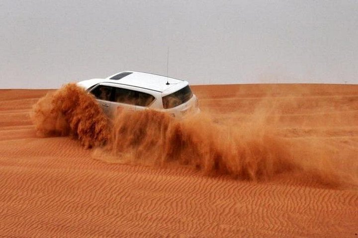 Morning desert safari in Dubai with quad biking, sandboarding, and camel rides on red dunes, photo 6 | wizardtrip