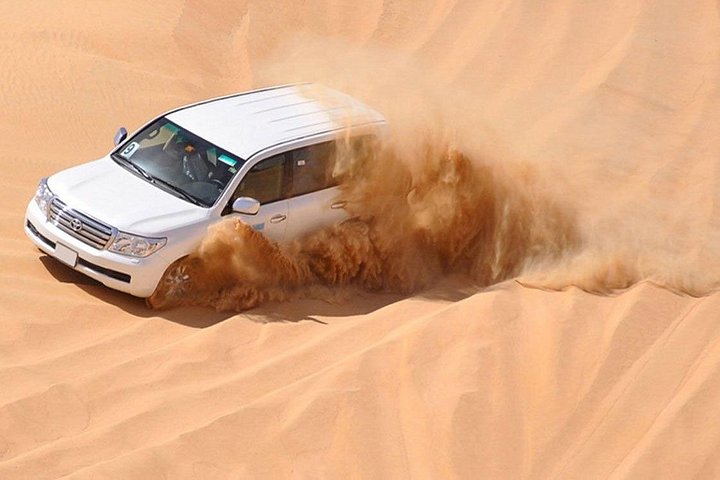Experience a thrilling desert safari in Dubai with dune bashing, camel rides, and a BBQ dinner, photo 6 | wizardtrip