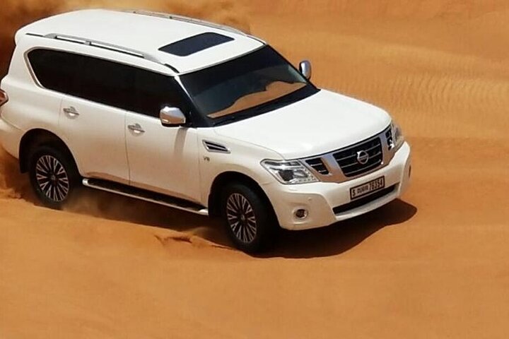 Experience a thrilling desert safari in Dubai with dune bashing, camel rides, and a BBQ dinner, photo 16 | wizardtrip