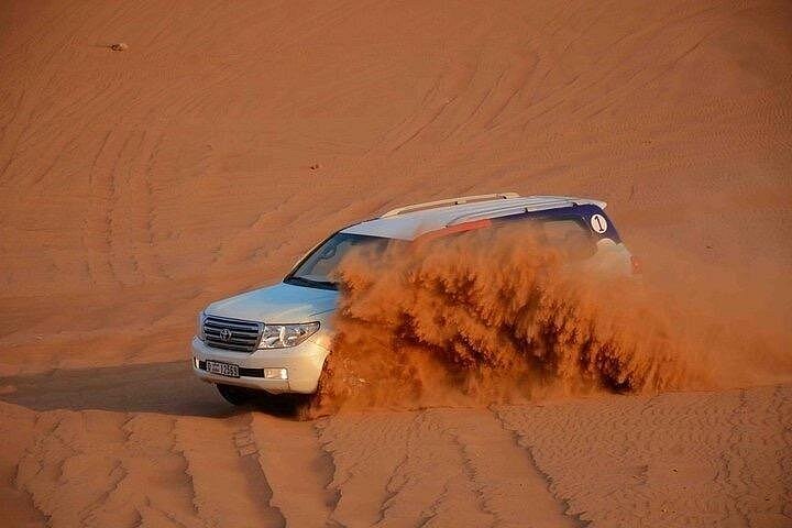 Experience a thrilling desert safari in Dubai with dune bashing, camel rides, and a BBQ dinner, photo 26 | wizardtrip