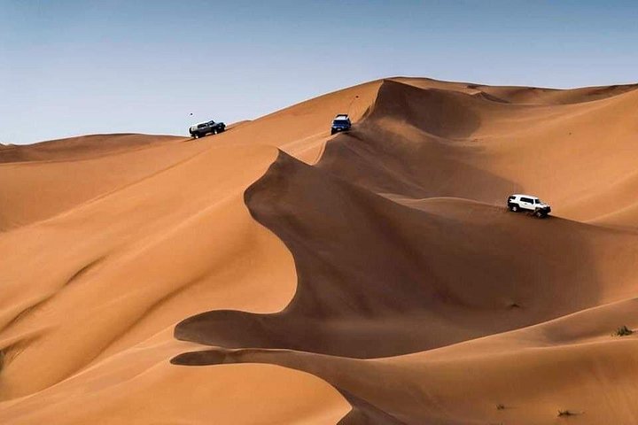 Experience a thrilling desert safari in Dubai with dune bashing, camel rides, and a BBQ dinner, photo 28 | wizardtrip