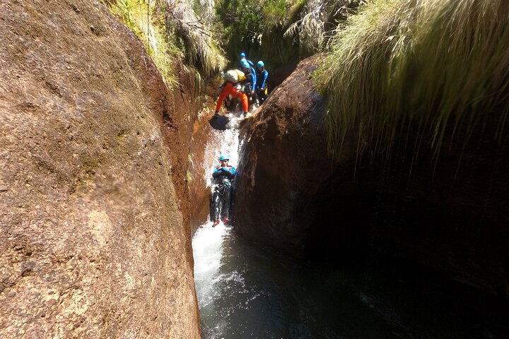 Beginner canyoning adventure in Madeira with rappels, jumps, and slides in a natural park, photo 30 | wizardtrip