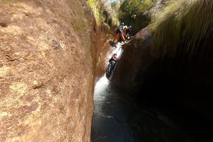 Beginner canyoning adventure in Madeira with rappels, jumps, and slides in a natural park, photo 32 | wizardtrip