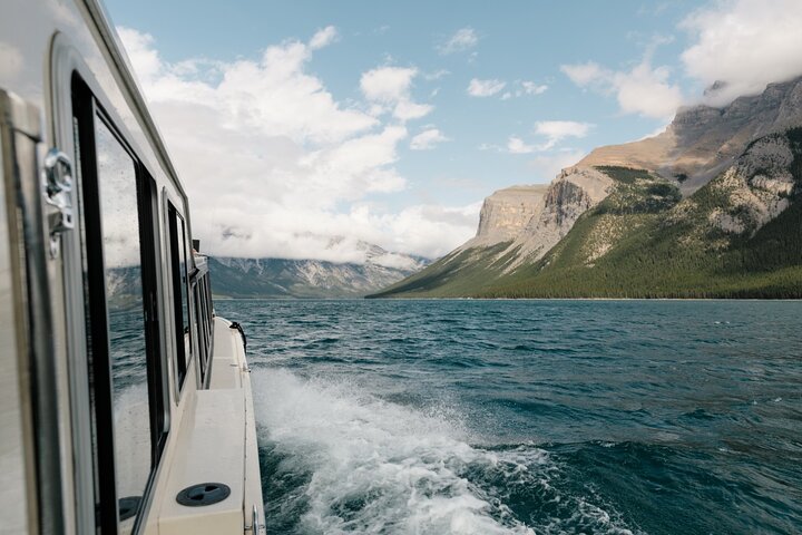 Scenic boat tour on Lake Minnewanka in Banff National Park, Canada, showcasing mountains and water, photo 6 | wizardtrip