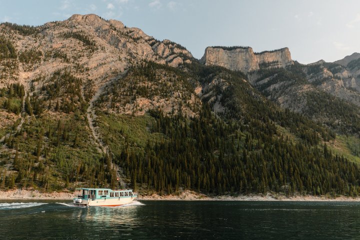 Scenic boat tour on Lake Minnewanka in Banff National Park, Canada, showcasing mountains and water, photo 7 | wizardtrip