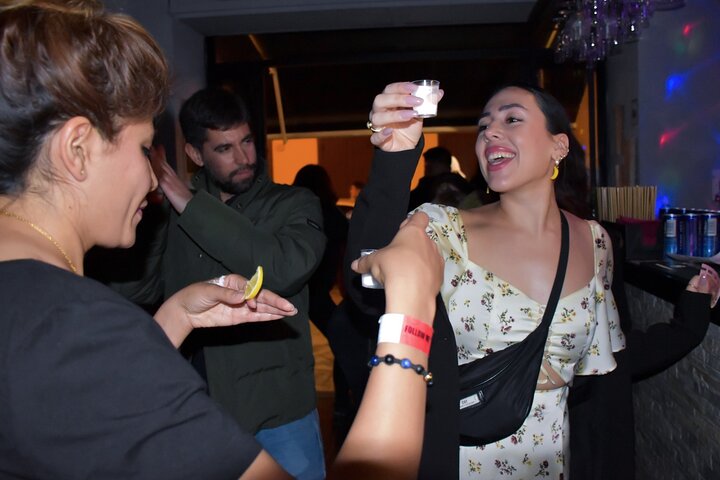 A lively pub crawl experience in Palermo, Sicily, with groups enjoying drinks and socializing in local bars, photo 10 | wizardtrip