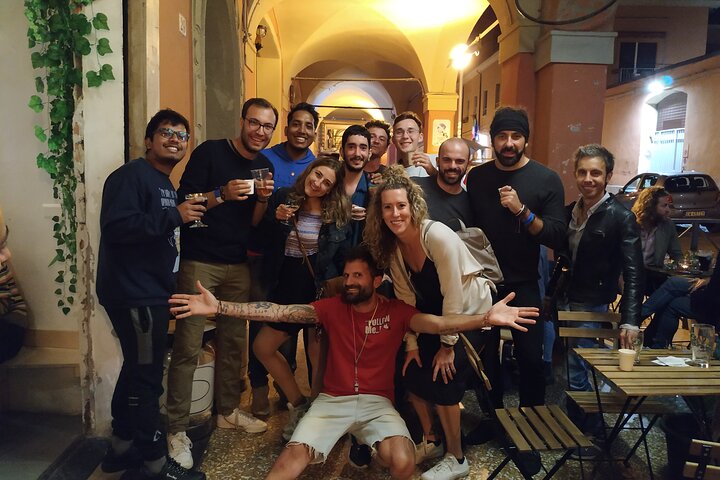 A lively pub crawl experience in Palermo, Sicily, with groups enjoying drinks and socializing in local bars, photo 11 | wizardtrip