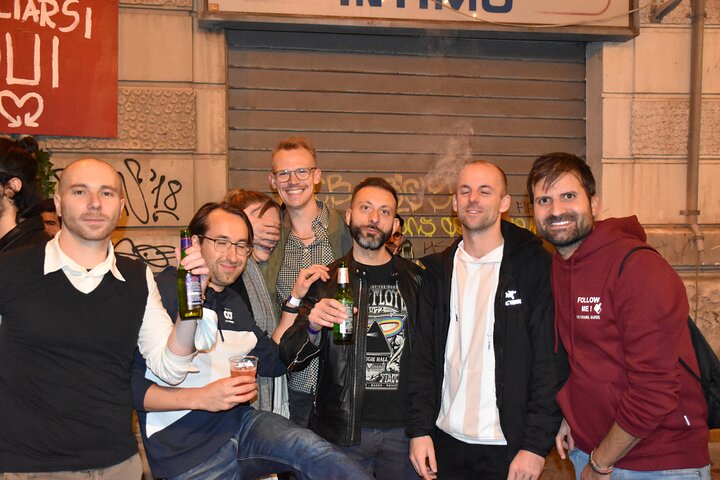 A lively pub crawl experience in Palermo, Sicily, with groups enjoying drinks and socializing in local bars, photo 19 | wizardtrip