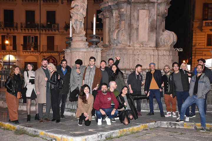 A lively pub crawl experience in Palermo, Sicily, with groups enjoying drinks and socializing in local bars, photo 20 | wizardtrip