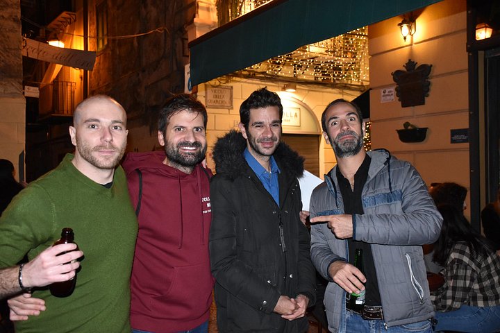 A lively pub crawl experience in Palermo, Sicily, with groups enjoying drinks and socializing in local bars, photo 23 | wizardtrip