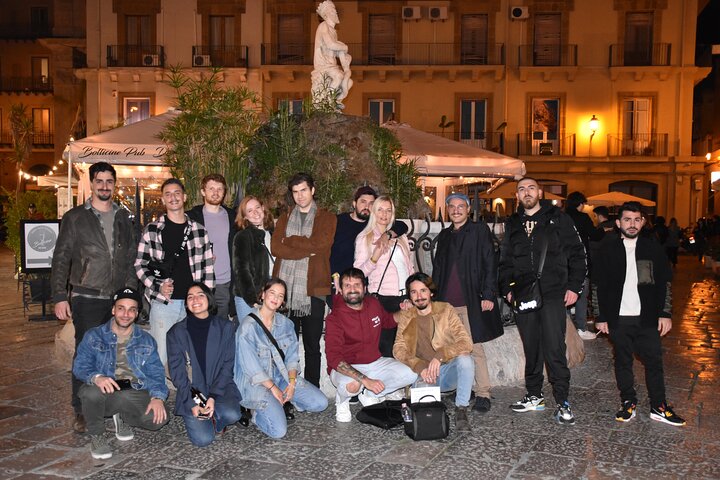 A lively pub crawl experience in Palermo, Sicily, with groups enjoying drinks and socializing in local bars, photo 31 | wizardtrip