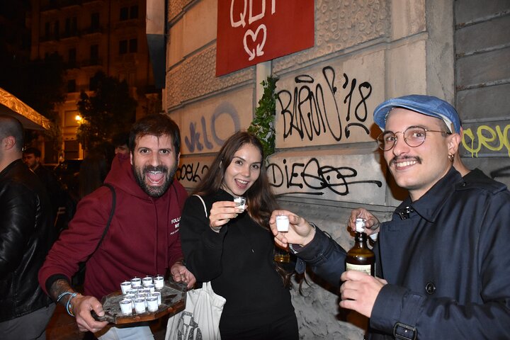 A lively pub crawl experience in Palermo, Sicily, with groups enjoying drinks and socializing in local bars, photo 32 | wizardtrip