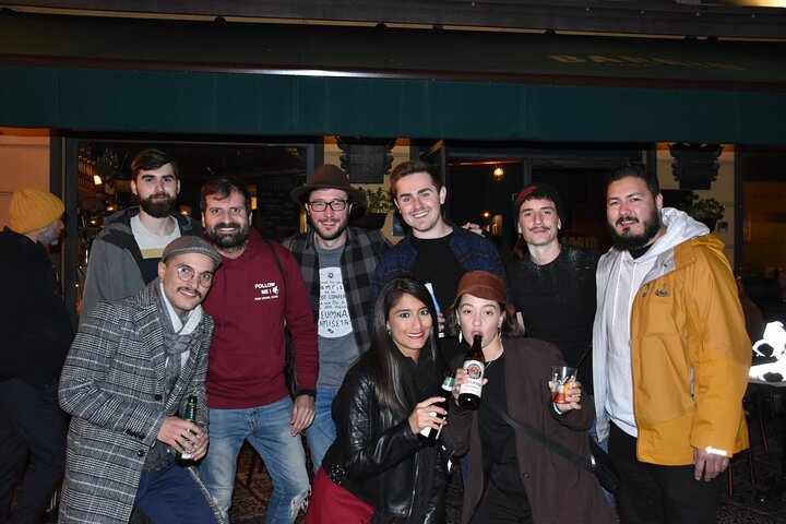 A lively pub crawl experience in Palermo, Sicily, with groups enjoying drinks and socializing in local bars, photo 33 | wizardtrip