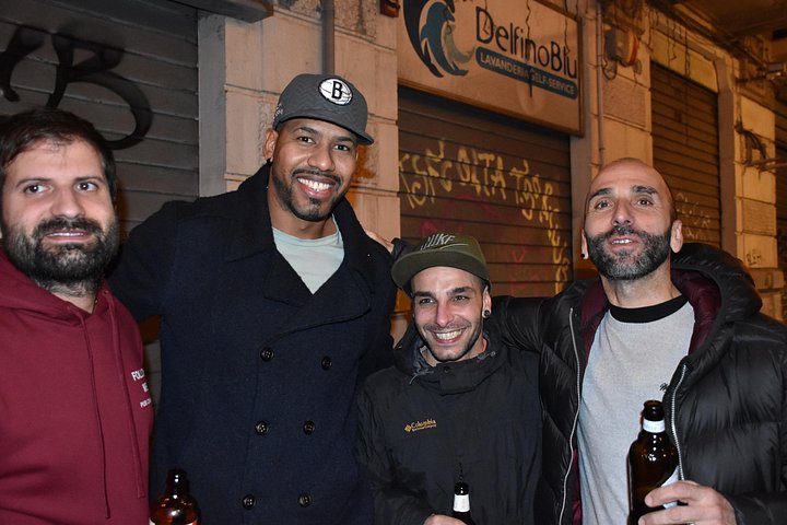 A lively pub crawl experience in Palermo, Sicily, with groups enjoying drinks and socializing in local bars, photo 35 | wizardtrip