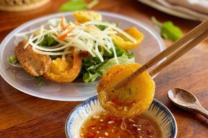 Utforska Hoi Ans livliga gatumatscen med en lokal guide, foto 15 | wizardtrip
