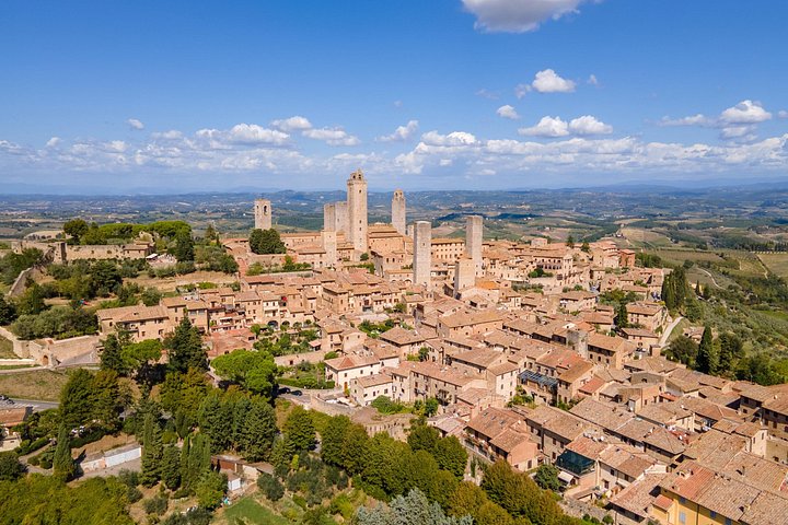 Excursion d'une journée de Florence à Sienne et San Gimignano, avec architecture médiévale et paysages toscans, photo 22 | wizardtrip