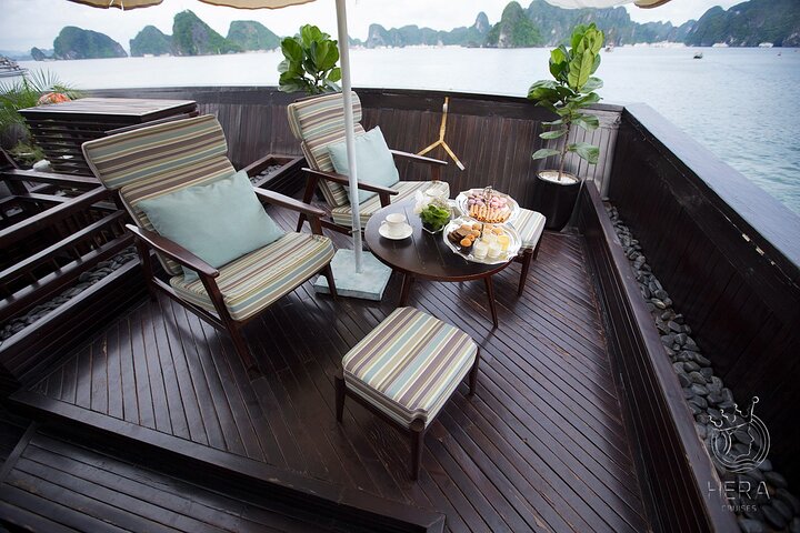 Luxury Hera Cruise navigating through the stunning karst formations of Halong Bay, Vietnam, photo 11 | wizardtrip