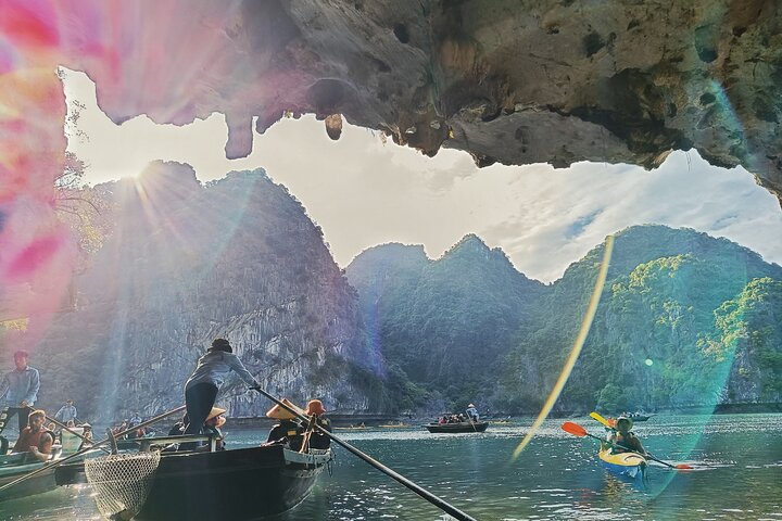 A scenic day tour of Halong Bay, Vietnam, featuring limestone karsts, emerald waters, and traditional boats, photo 7 | wizardtrip