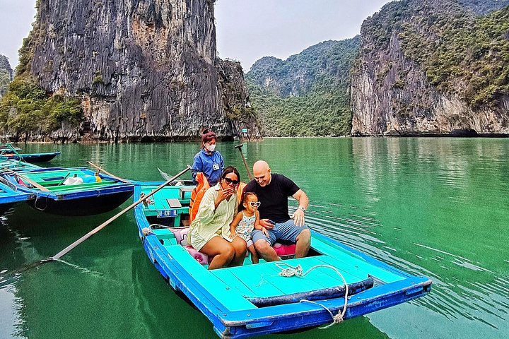 A scenic day tour of Halong Bay, Vietnam, featuring limestone karsts, emerald waters, and traditional boats, photo 8 | wizardtrip