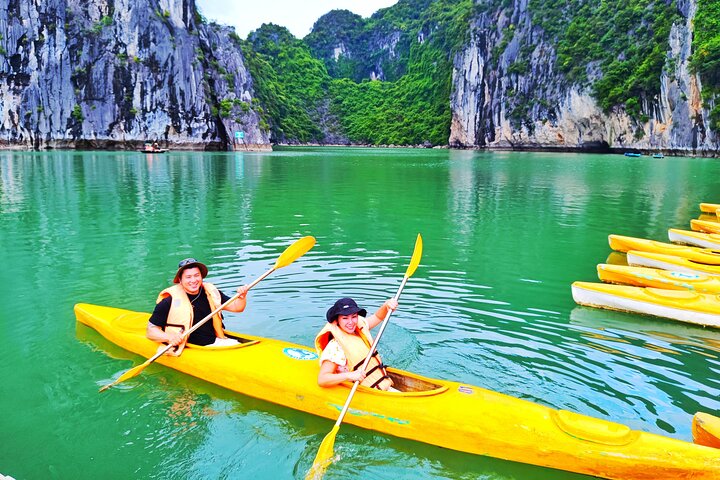 A scenic day tour of Halong Bay, Vietnam, featuring limestone karsts, emerald waters, and traditional boats, photo 15 | wizardtrip